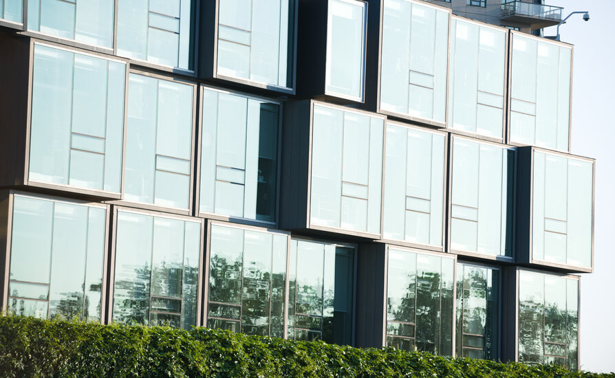 Building with light reflecting off glass windows